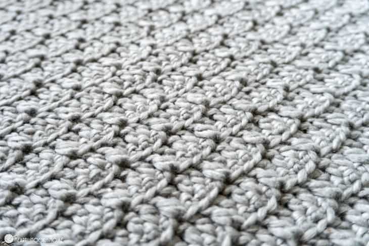 Up close of a sample of the Bricktown Slouch Beanie crochet pattern in a Bunny colorway of Snuggle Puff yarn from WeCrochet, showing the texture of the Brick Stitch.