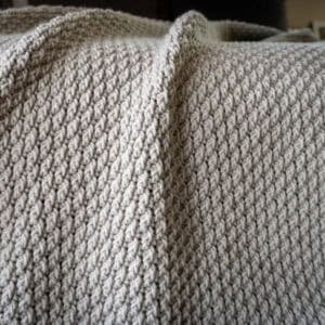 gray crochet blanket using Alpine Stitch
