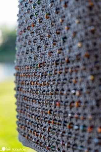 Gray sample of the Cross-Body Bead Bag crochet pattern with natural colored beads.