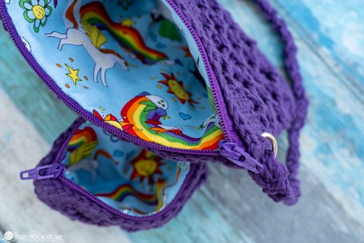 Inside view of a fat quarter lining in a purple colorway example of the Girl\'s Best Friend Crossbody Purse crochet pattern.