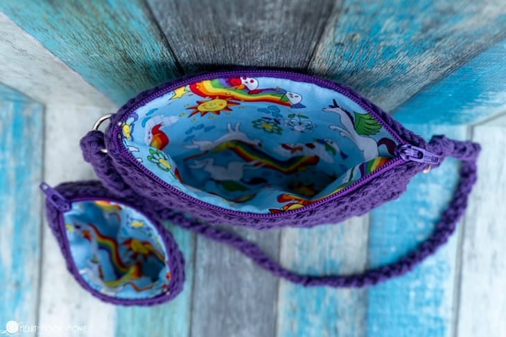Inside view of a fat quarter lining in a purple colorway example of the Girl\'s Best Friend Crossbody Purse crochet pattern.