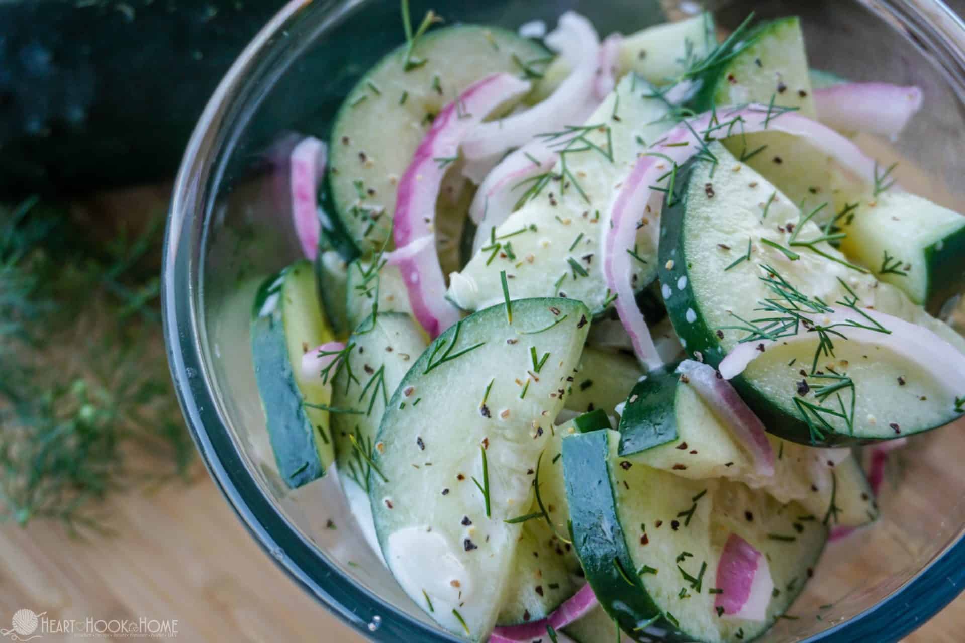 An example of The Best Summertime Cucumber Salad recipe with cucumbers and Red Onions in a bowl.
