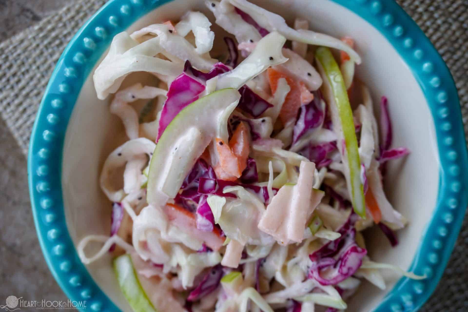 Sample of the Summertime Green Apple Cole Slaw recipe in a white and blue bowl.