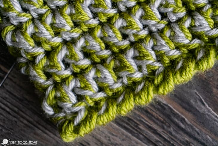 Green and white example of the Easy Peasy 30-Minute Beanie Crochet Pattern showing the Crab Stitch border up close.