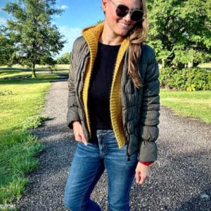 gold crocheted hooded vest with green puffer jacket