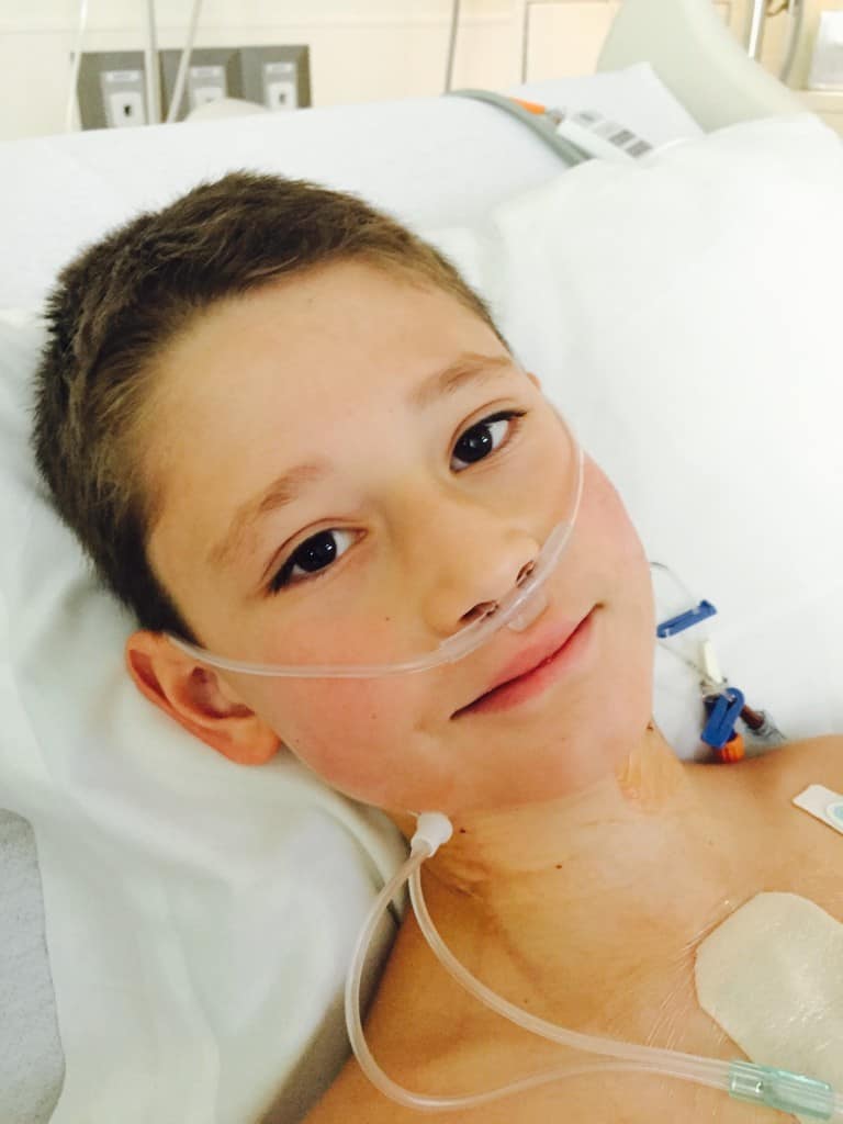 Smiling male child wearing a Cannula, 