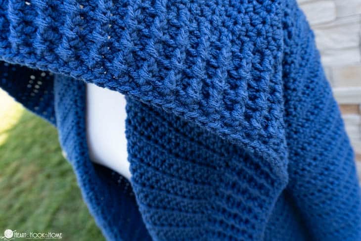 Blue example of a crocheted cardigan.