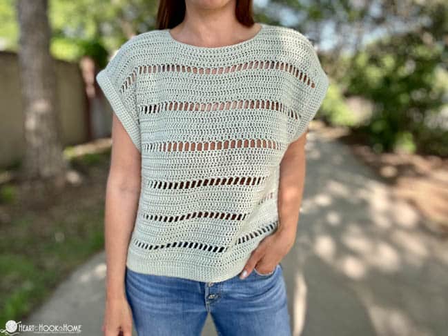 Godiva Tee on a female model wearing jeans in a park.