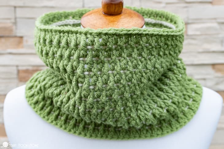 Sage green and white example of the I'll Pine For You crochet pattern on a white dress form.