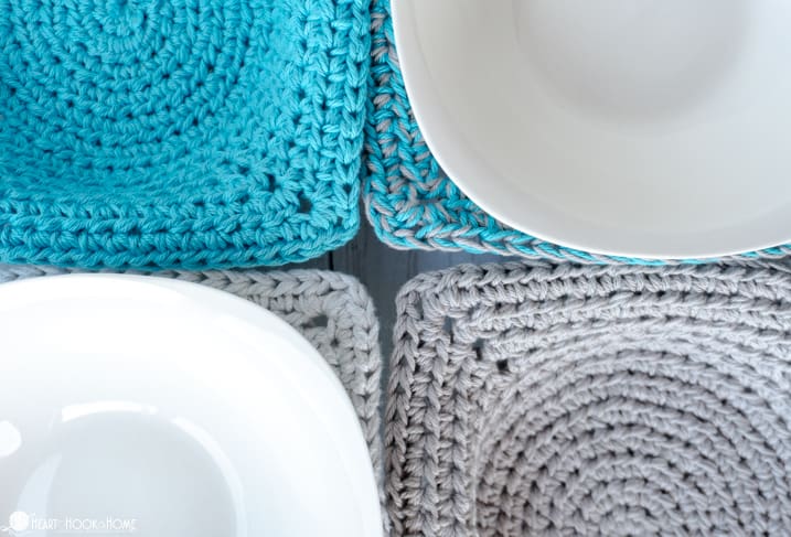 Four examples of the Quick & Easy Microwave Bowl Cozy Crochet Pattern in Teal and Gray colorways with a white bowl nestled in two of them.