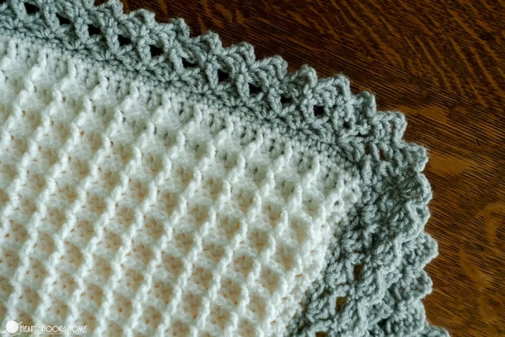 Up close of a gray border on an example of the Crochet Stitch Sampler Afghan Pattern.