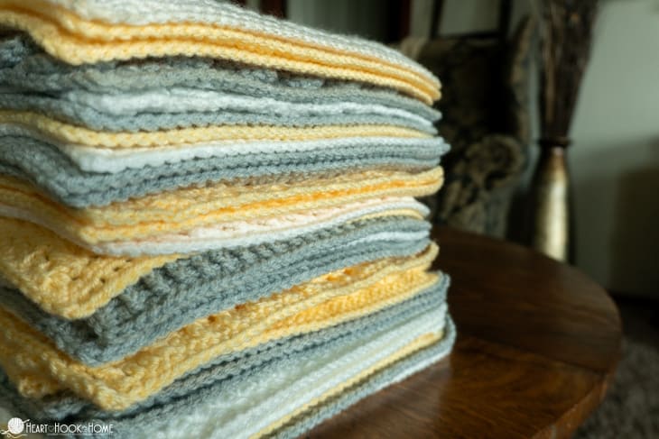 Stacked squares for a silver, white, and gold example of the Crochet Stitch Sampler Afghan Pattern.