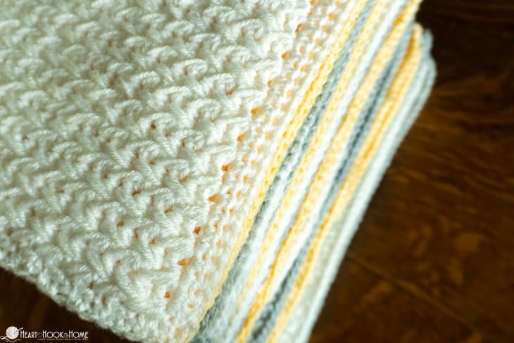 Stacked squares for a silver, white, and gold example of the Crochet Stitch Sampler Afghan Pattern.
