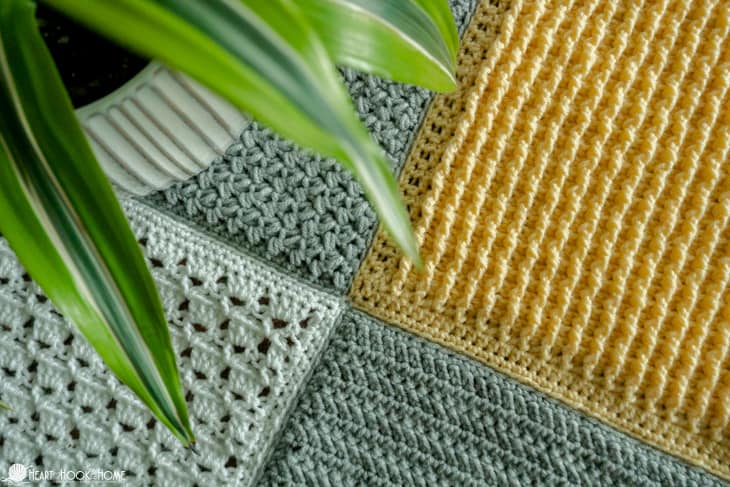 Silver, white, and gold example of the Crochet Stitch Sampler Afghan Pattern.