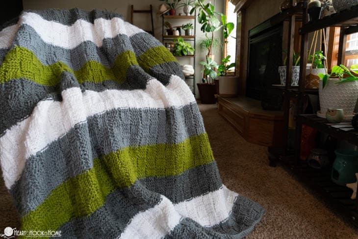 Tunisian Basket Weave Blanket draped over a chair.