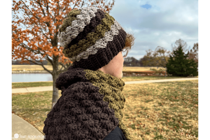 Andy’s Scarf & Beanie Crochet Pattern Set on a male model in a park.