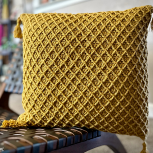 Gold example of the Diamond Pillow Cover crochet pattern.